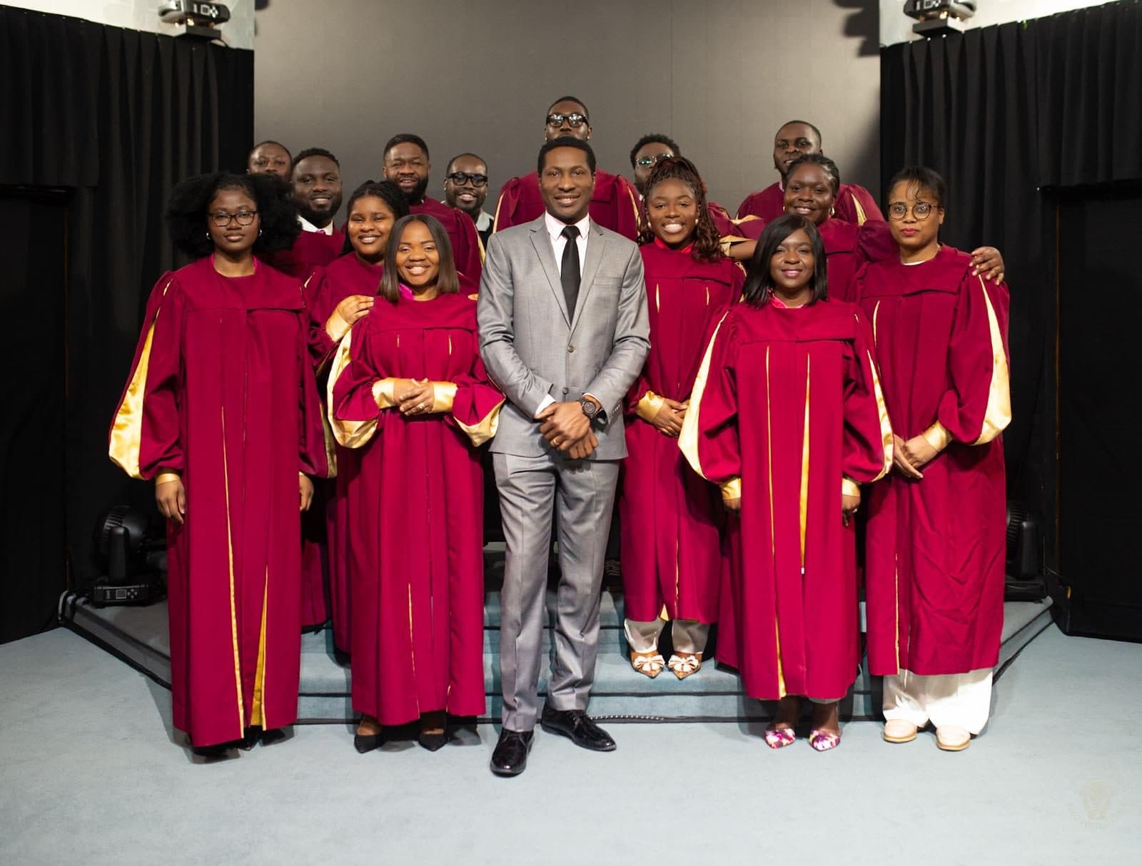 The choir in crimson robes